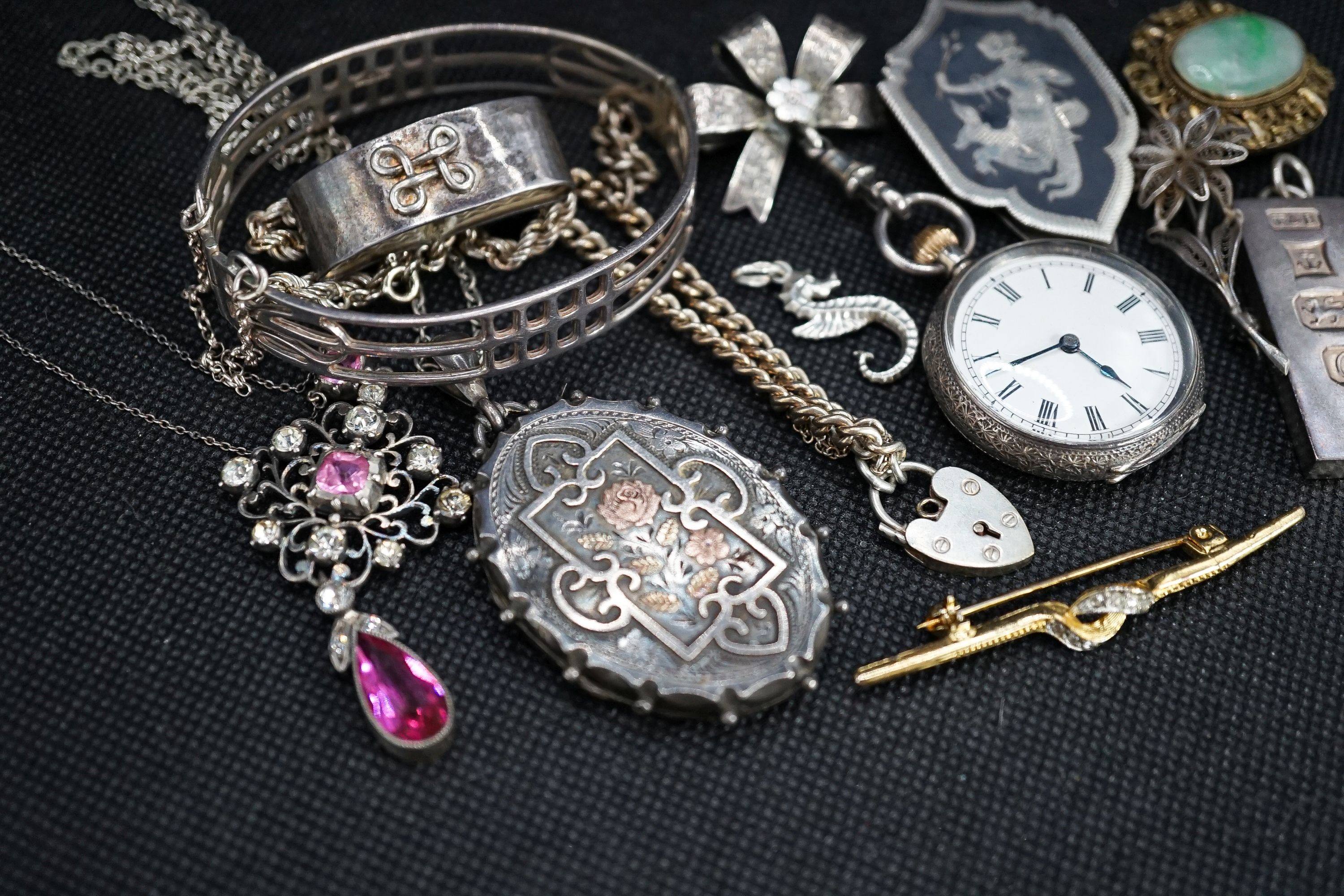 A silver fob watch, a late Victorian silver oval locket and other items of minor jewellery.